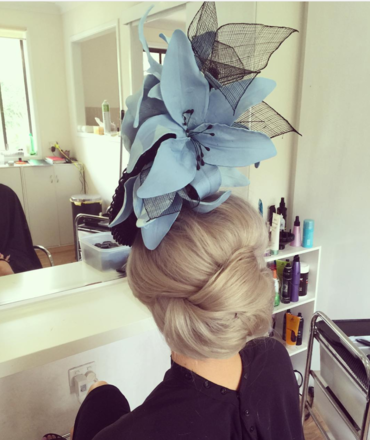 Black brimmed percher with big blue flowers 