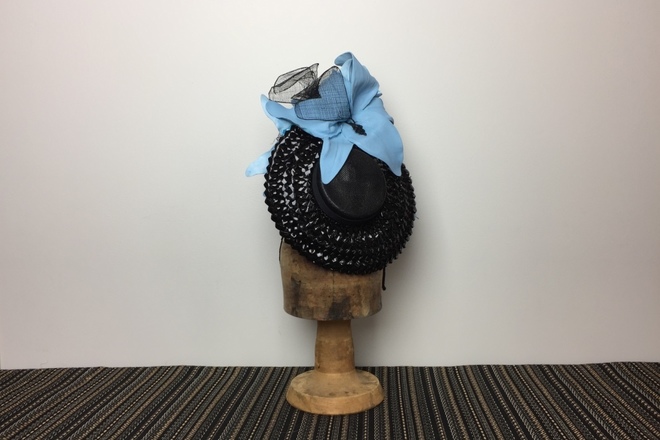 Black brimmed percher with big blue flowers 