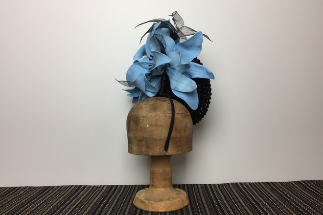 Black brimmed percher with big blue flowers 