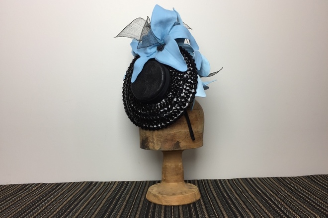 Black brimmed percher with big blue flowers 