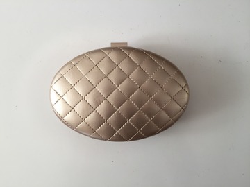 For Rent: Oval gold clutch