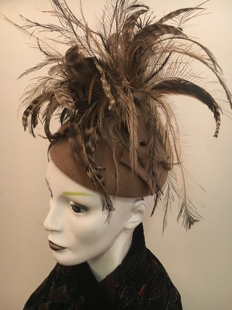 Taupe fur felt with profusion of feathers