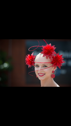 Red floral headpiece with quills