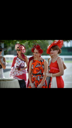 Red floral headpiece with quills