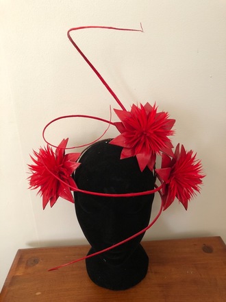 Red floral headpiece with quills