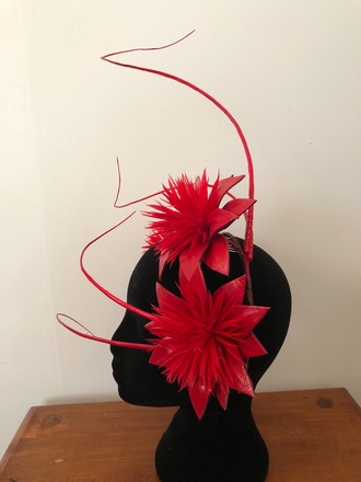 Red floral headpiece with quills