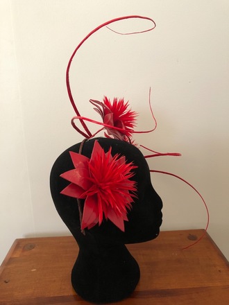 Red floral headpiece with quills
