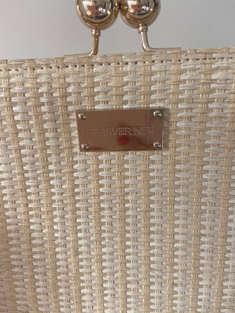 Straw clutch with gold detail 