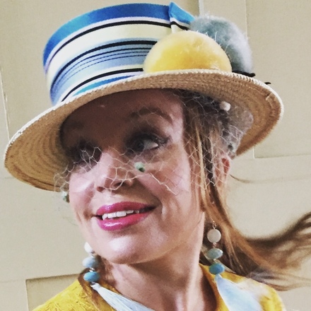 Straw boater with vintage ribbon, pom poms and veiling