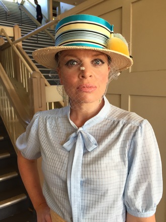 Straw boater with vintage ribbon, pom poms and veiling