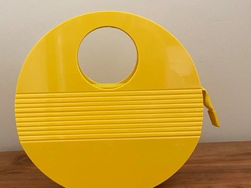 For Rent:  Yellow  Acrylic Olga berg handle bag.