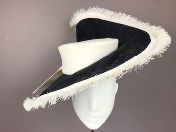For Rent: Big black brim with upsweep and white fringe.