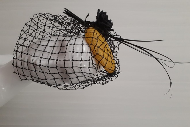 Black and yellow button with vintage veil