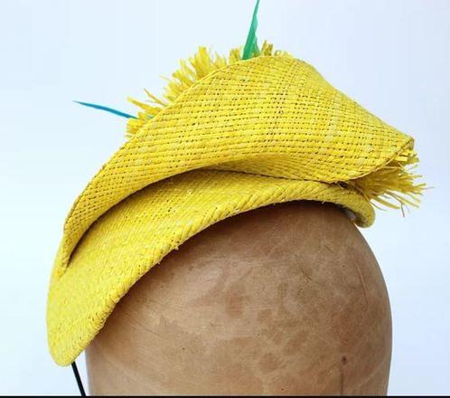 Yellow raffia headpiece with blue feather detail