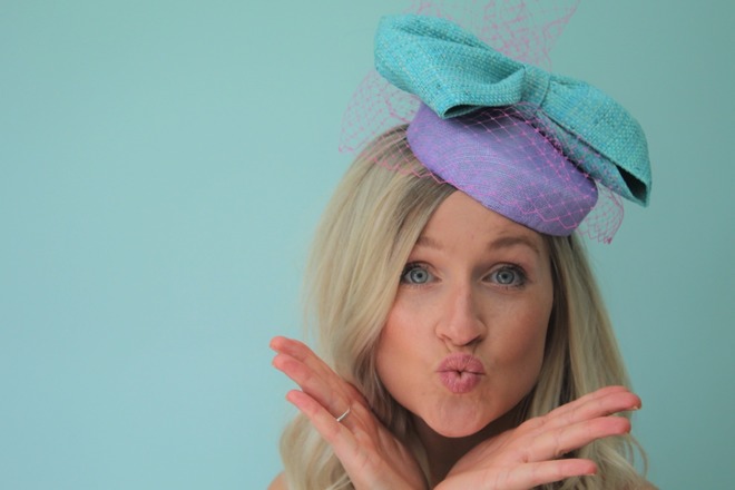 Lilac Sinamay pillbox with large blue raffia bow and vieling