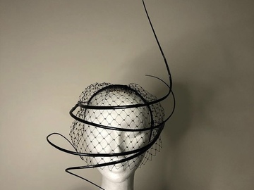 For Rent: Black sculpture with veiling millinery 