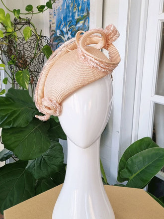 Soft apricot curve headpiece with sculptural swirl