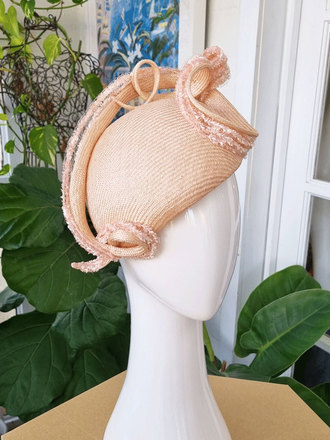 Soft apricot curve headpiece with sculptural swirl