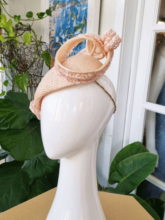 Soft apricot curve headpiece with sculptural swirl