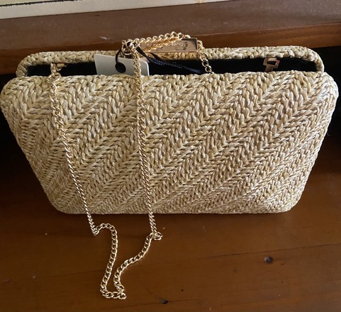 Olga Berg Natural woven pod clutch