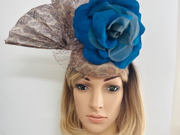 For Sale: Blue silk flower on animal print button hat