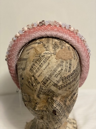 Soft pink headband with jewels wrapped in veiling 
