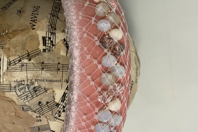 Soft pink headband with jewels wrapped in veiling 
