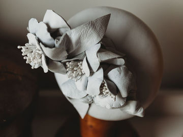For Sale: Off White Leather flower headpiece button percher